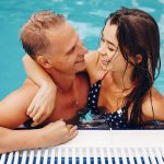 elegant-couple-swim-in-the-pool-XNWHKDR.jpg